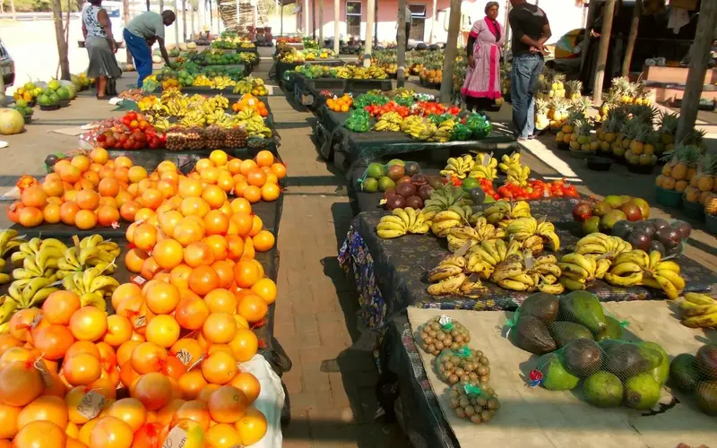 Oranges in a black plastic crate