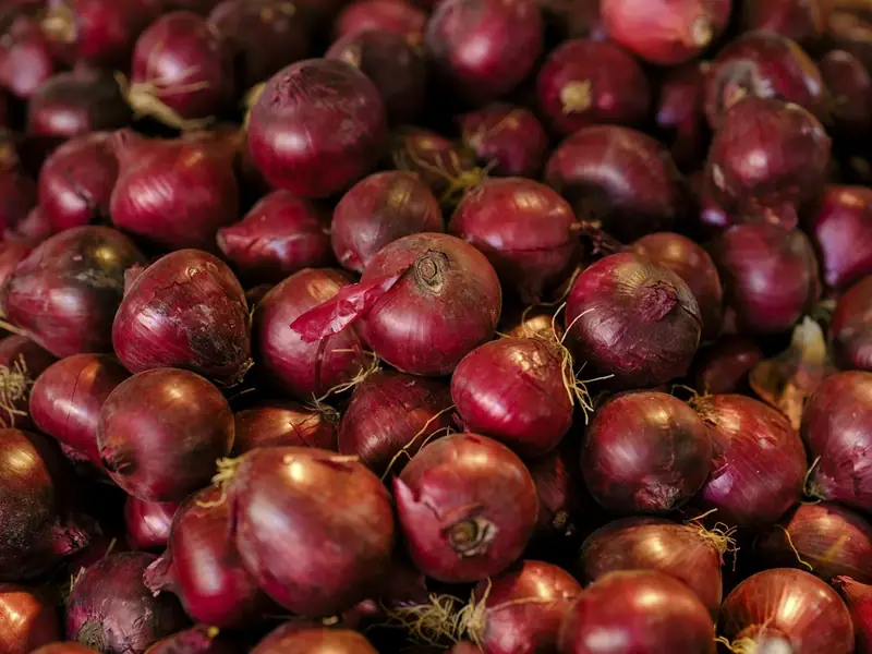 A pile of red onions